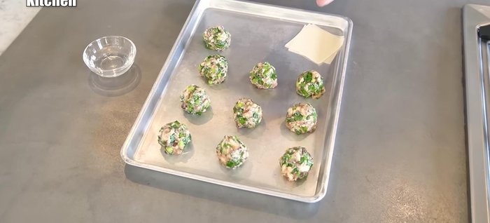 Place a shumai skin on a flat surface. Place a meatball in the center.