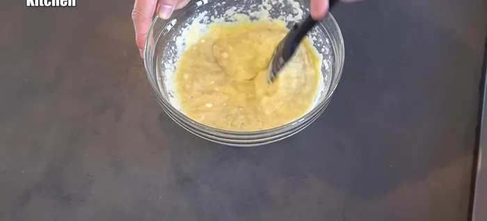 Combine the grated potatoes and onion with the egg and flour mixture.