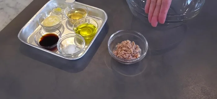 Prepare the dressing: Combine mayonnaise, minced garlic, sugar, soy sauce, and olive oil. Mix well.