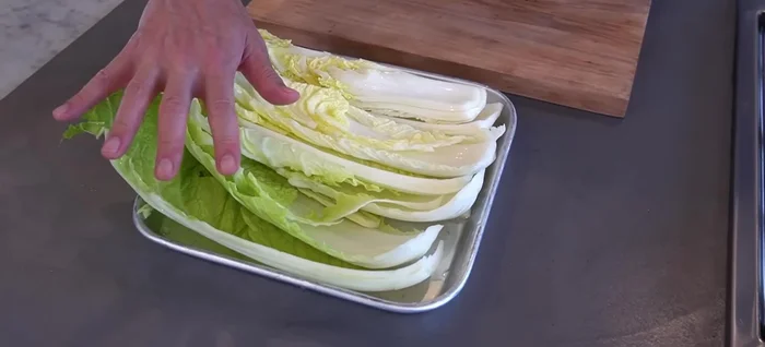 Separate the outer leaves and cut the inner leaves into thin strips, cutting against the fibers.