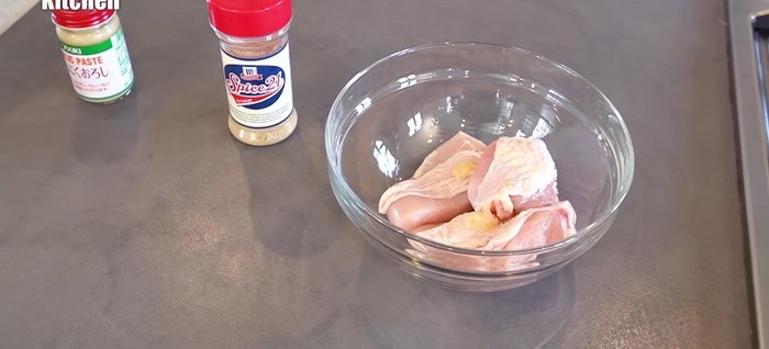 Season the chicken with grated garlic and McCormick's Spice 21 (or a similar blend of spices). Rub the spices thoroughly into the chicken.