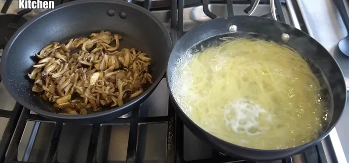Add the cooked spaghetti to the pan with mushrooms and soy sauce, tossing to combine. Add any reserved pasta water to create a sauce.