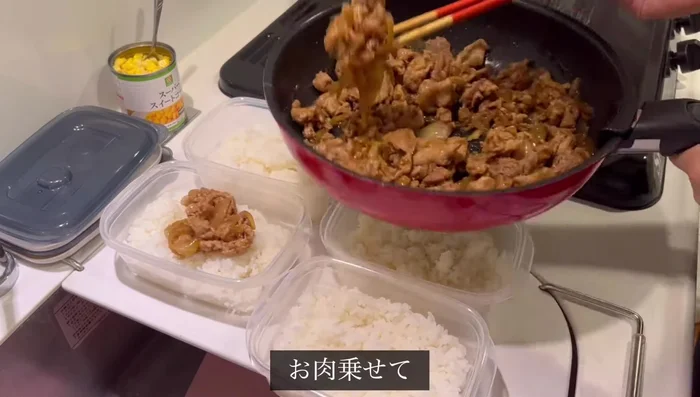 Place cooked rice in bento boxes. Top with the meat mixture, green onions, corn, and a piece of butter.