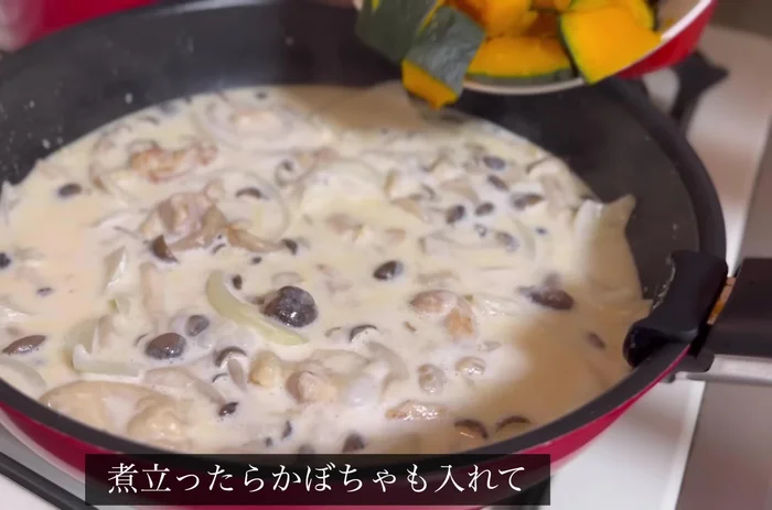Once boiling, add the cooked pumpkin, mash it, and mix until the color changes.
