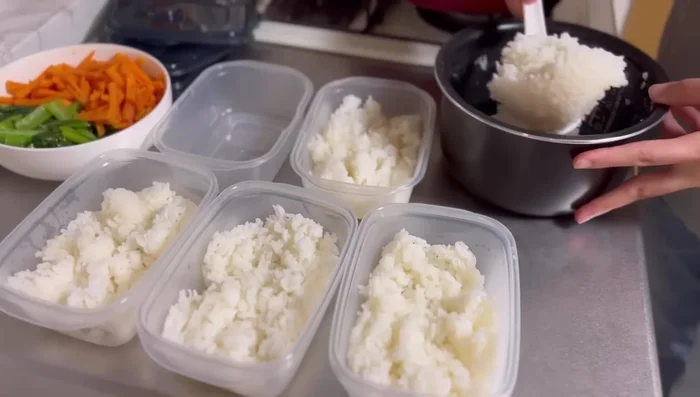 Assemble bento: Spread cooled rice, then add namul (to prevent soaking). Top with hamburger steak and sauce.
