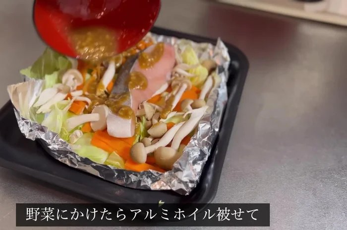 Pour mixture over vegetables, drizzle with cooking oil, and cover with foil.