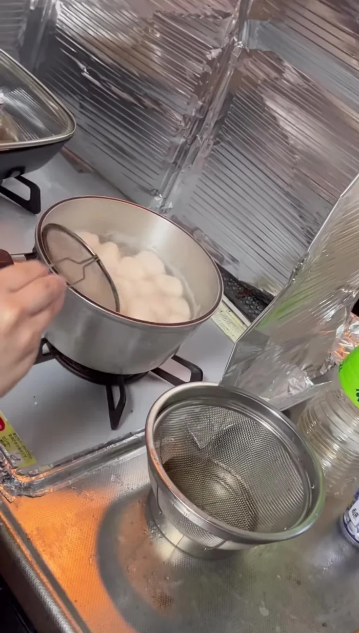Check if the dumplings are cooked.