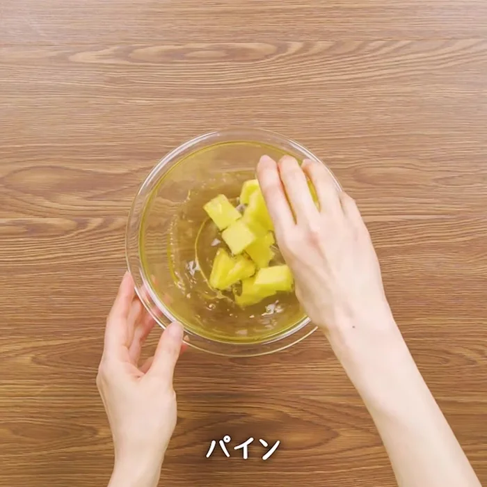 Combine the fruits, sugar, and water in a blender.