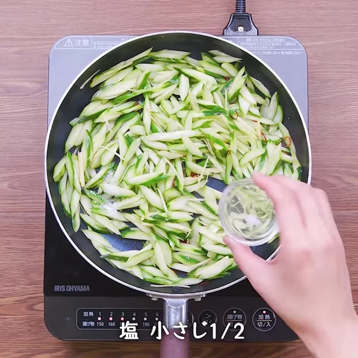 Add the sliced cucumber and ginger to the pan. Stir-fry for 2-3 minutes until the cucumber is slightly softened but still crisp.