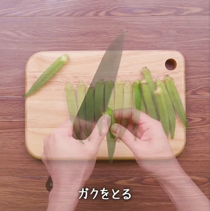 Prepare the ingredients: Wash and cut tomatoes and okra into bite-sized pieces. (Specific cutting instructions are missing from the audio.)