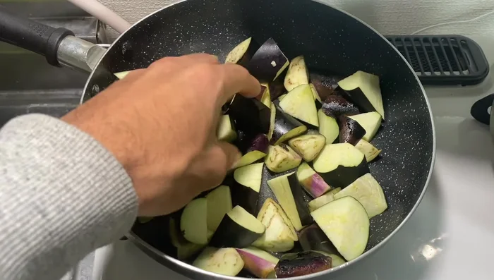 Add eggplant and stir-fry until browned. Remove from pan.