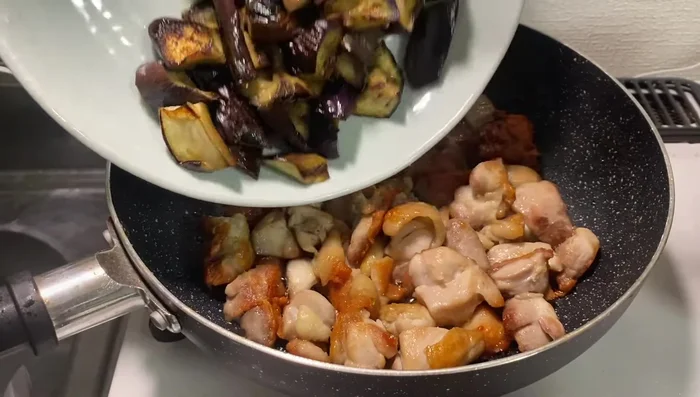 Return the eggplant to the pan. Add miso paste and other sauce ingredients according to package instructions (likely Cook Do brand). Stir to combine.