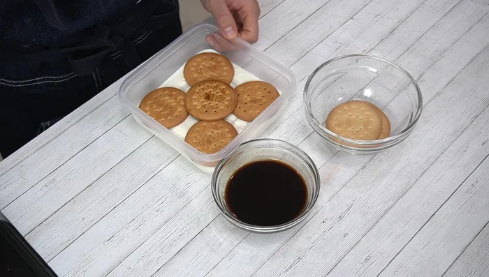 Repeat layers: batter, biscuits, batter, biscuits.
