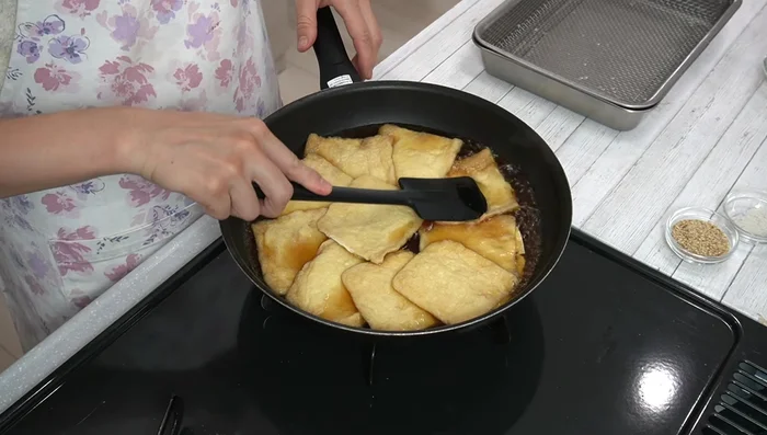Simmer the tofu: Add the blanched tofu to the simmering sauce. Cook until the liquid evaporates, turning occasionally to ensure even soaking.