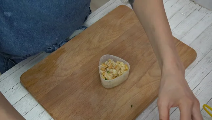 Shape the spicy rice balls firmly, wet your hands to help.