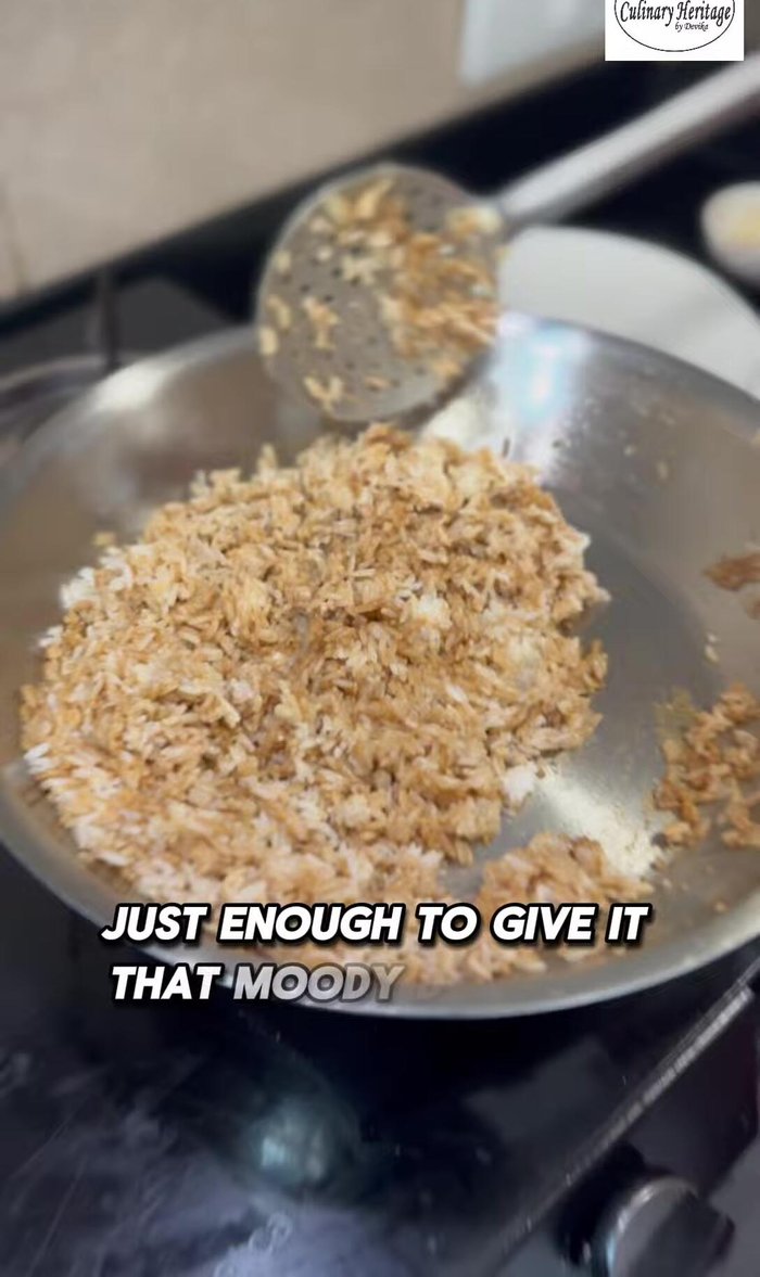 Add the cooked scrambled eggs and spring onions to the rice.