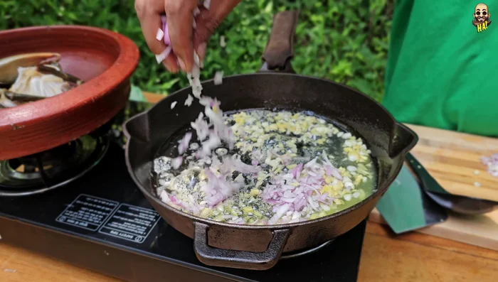 Add chopped onion to the pot.