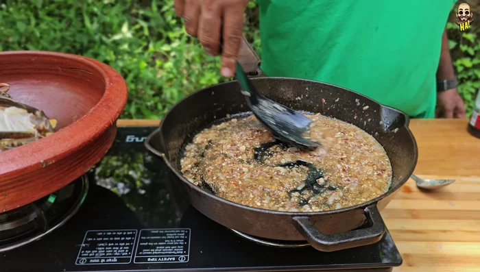 Add the cleaned mud crab to the pot.