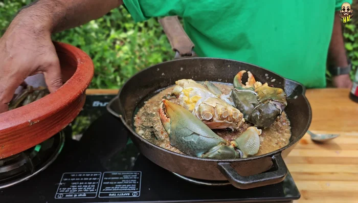 Cook the crab until done (the color will change to red).
