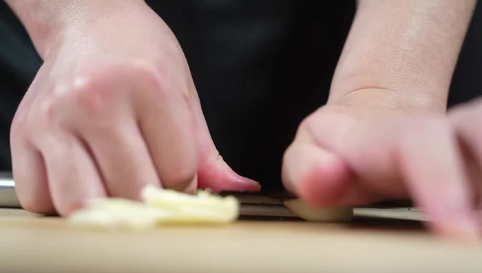 Crush garlic. Chop cucumbers, removing stems. (Garlic reduces grassy cucumber flavor)