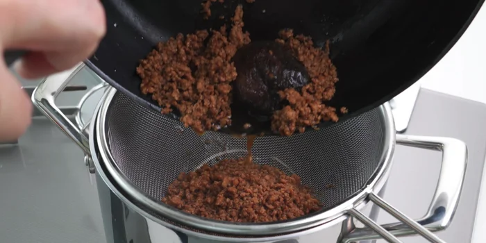 Strain the broth, pressing on the solids to extract all the flavor. Save the solids for other dishes.