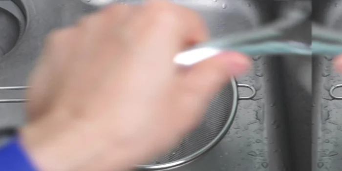 Warm bowls with boiling water, drain noodles, and add them to the bowls. Ladle the broth over the noodles.