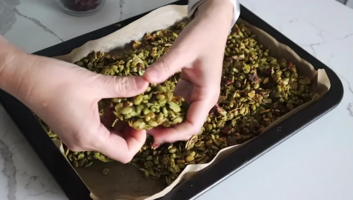 Once cooled, break up the granola by hand into desired size pieces.