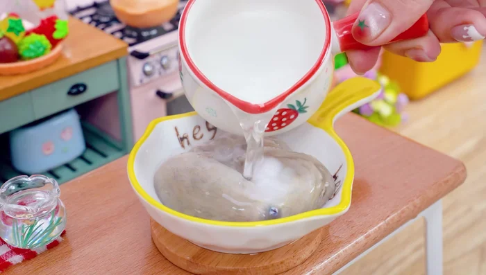 Pour hot water over the octopus. Take it out.