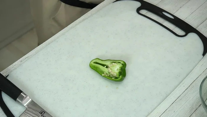 Cut the peppers in half and remove the seeds and any white membrane (optional).