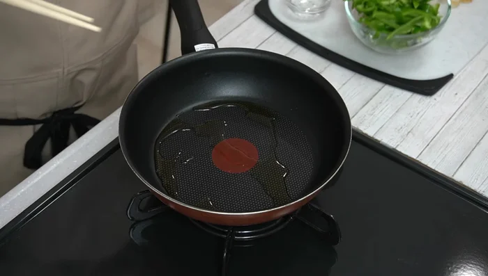 Add the bell peppers and stir-fry for about 1 minute.
