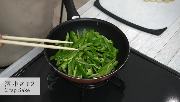 Add sake and continue stir-frying.