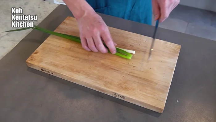 Prepare the green onions: Finely chop the green onions.