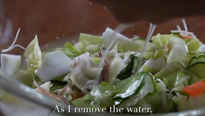 Squeeze out excess water from the vegetables. This step is crucial for the flavor to soak in.