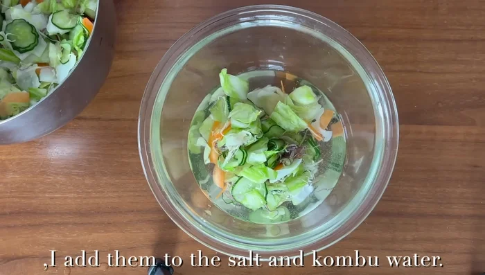 Add the vegetables to the second bowl of saltwater (with kombu). Press down again. Cover with a wrap and refrigerate for at least 2 hours.
