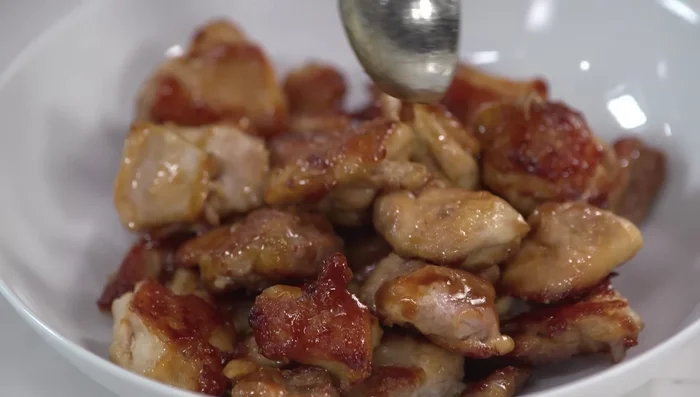 Strain the glaze for a smoother consistency and drizzle over the chicken. Serve over steamed white rice.