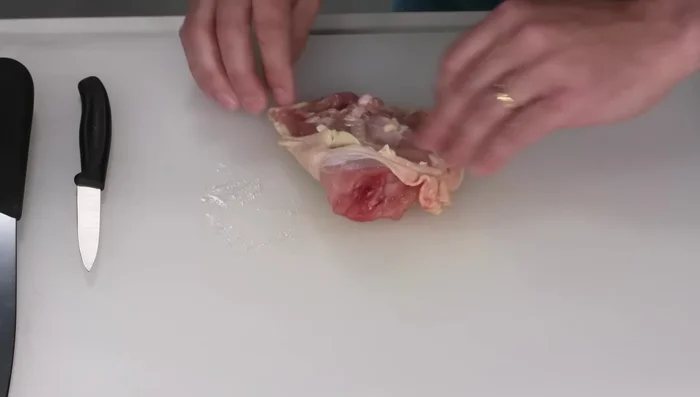 Remove the bones from the chicken thighs, leaving the skin on. Cut the thighs into 1 1/2-inch pieces.