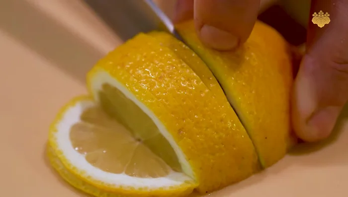 Cut the lemon into half-moons.