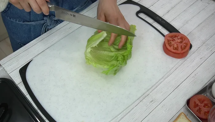 Wash and dry lettuce. Tear or cut into desired size.
