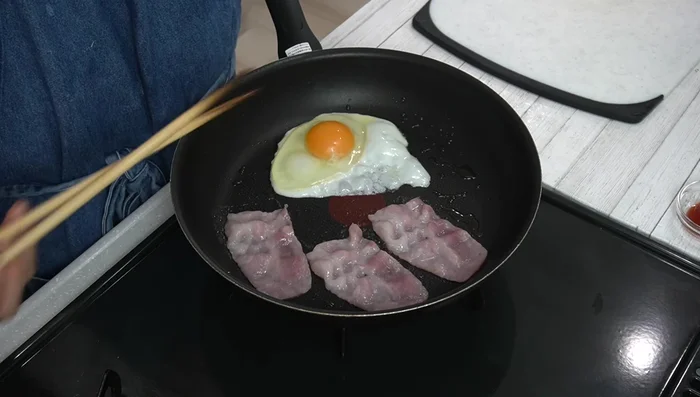 Fry bacon until browned, flipping halfway through.