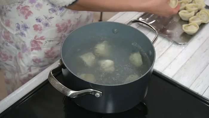 Boil the dumplings: Bring a pot of water to a boil. Carefully add the dumplings, ensuring not to overcrowd the pot. Boil for 4-5 minutes, or until they float to the surface.