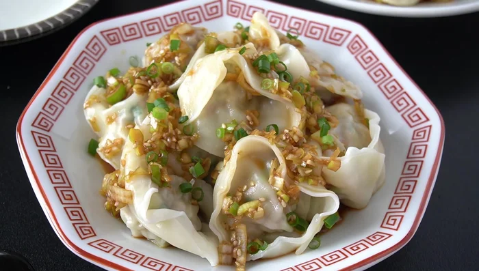 Serve: Remove the dumplings from the pot and arrange on a plate. Top generously with the prepared scallion sauce and enjoy!