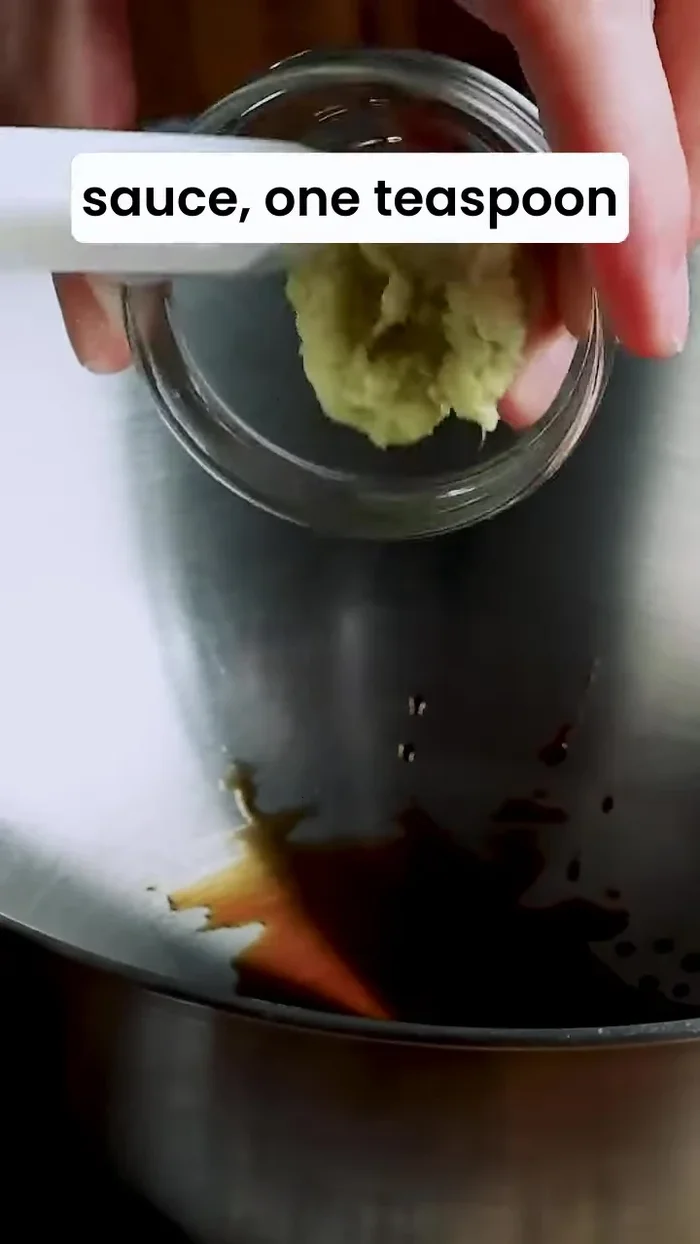 Prepare the marinade: Mix soy sauce, ginger, garlic, sake, and sesame oil in a bowl. Add chicken pieces, ensuring even coating. Cover with plastic wrap, touching the chicken surface, and refrigerate for 30 minutes.