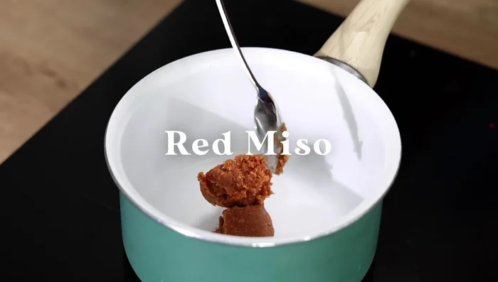 Make the miso sauce: Combine miso paste, sugar, sake, mirin, soy sauce, grated garlic and ginger, and water in a saucepan. Cook over medium-low heat for 3 minutes, stirring constantly.
