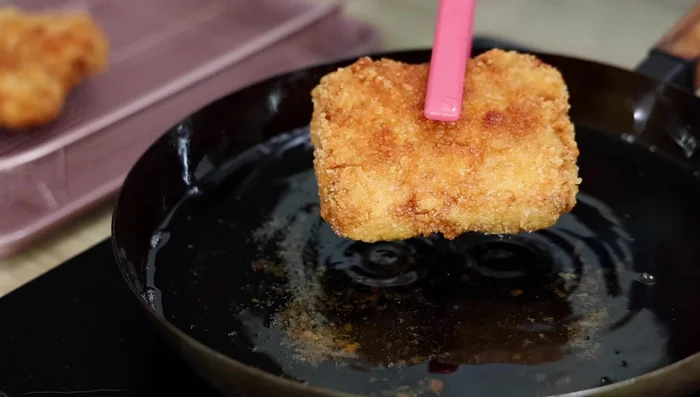 Remove from oil and drain on a mishrack. Slice into bite-sized pieces.