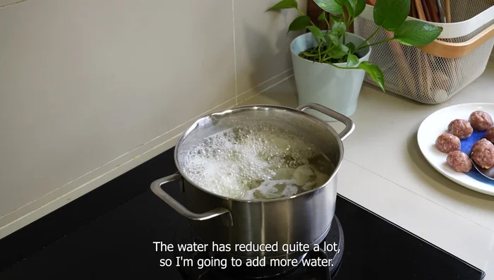 Once the radish is cooked, add more water if needed. Ensure the soup is at a rolling boil before gently adding the meatballs. Cook for 8-10 minutes, or until the meatballs are cooked through and floating.