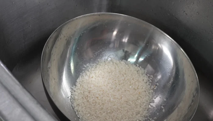 Prepare the rice: Rinse rice until water runs clear.