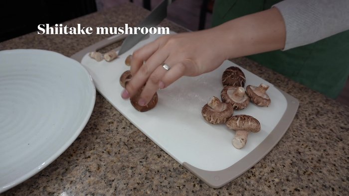 Prepare the mushrooms: Remove stems from shiitake, chop finely. Trim and slice eringi into small pieces. Gently tear maitake into bite-sized pieces. Chop carrots.