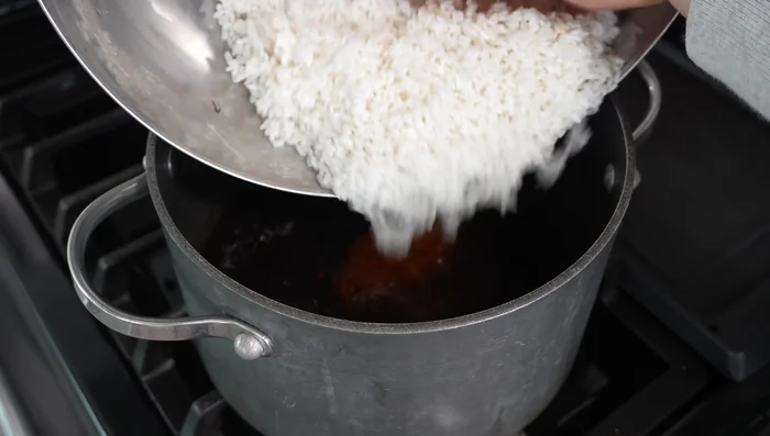 Cook the rice: In a pot, add sauce mixture, rinsed rice, and chopped vegetables. Stir well. Bring to a boil, cover, reduce heat, and cook until liquid is absorbed. Stir gently and serve warm.