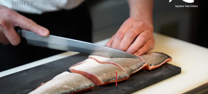Make shallow cuts in the salmon skin to help it cook evenly.