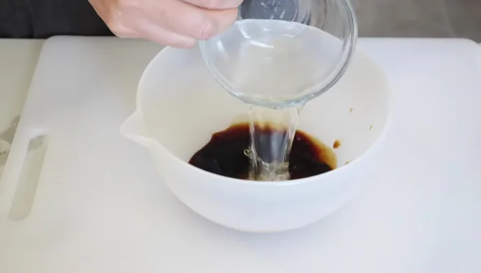 In a small bowl, mix soy sauce, sake, and mirin. Stir and set aside.